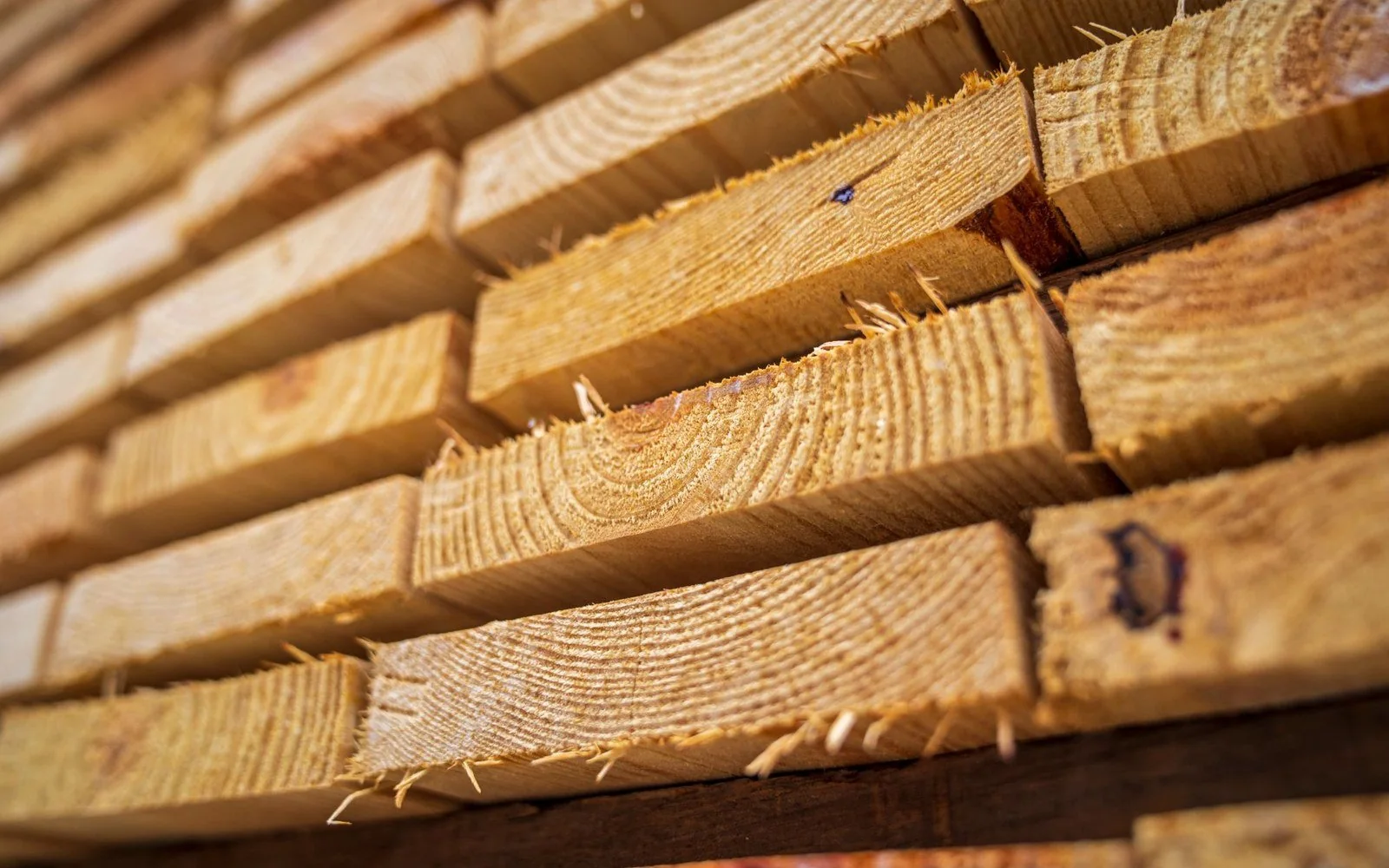 Stacked sawn timber showing material grain and finish